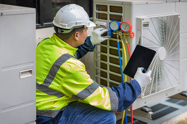 Professional Heat Pump Repair technician working in Upton, MA